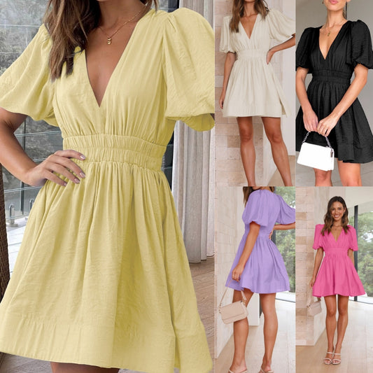 Robe élégante, col en V, manches lanternes.